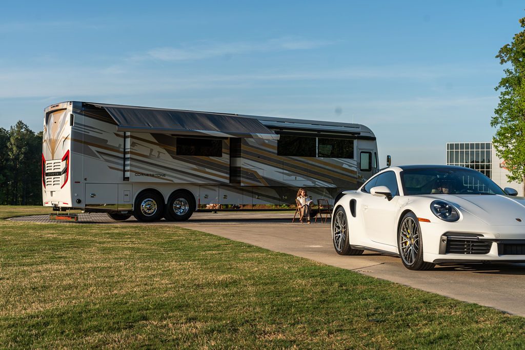 Cornerstone Series 6 exterior with a white Porsche beside the coach