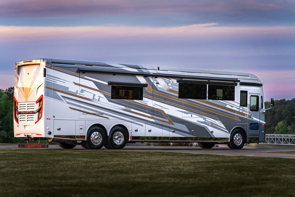 Cornerstone Series 6 luxury coach at twilight